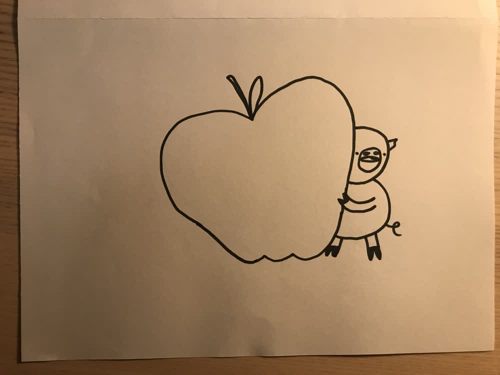 a pig with an apple