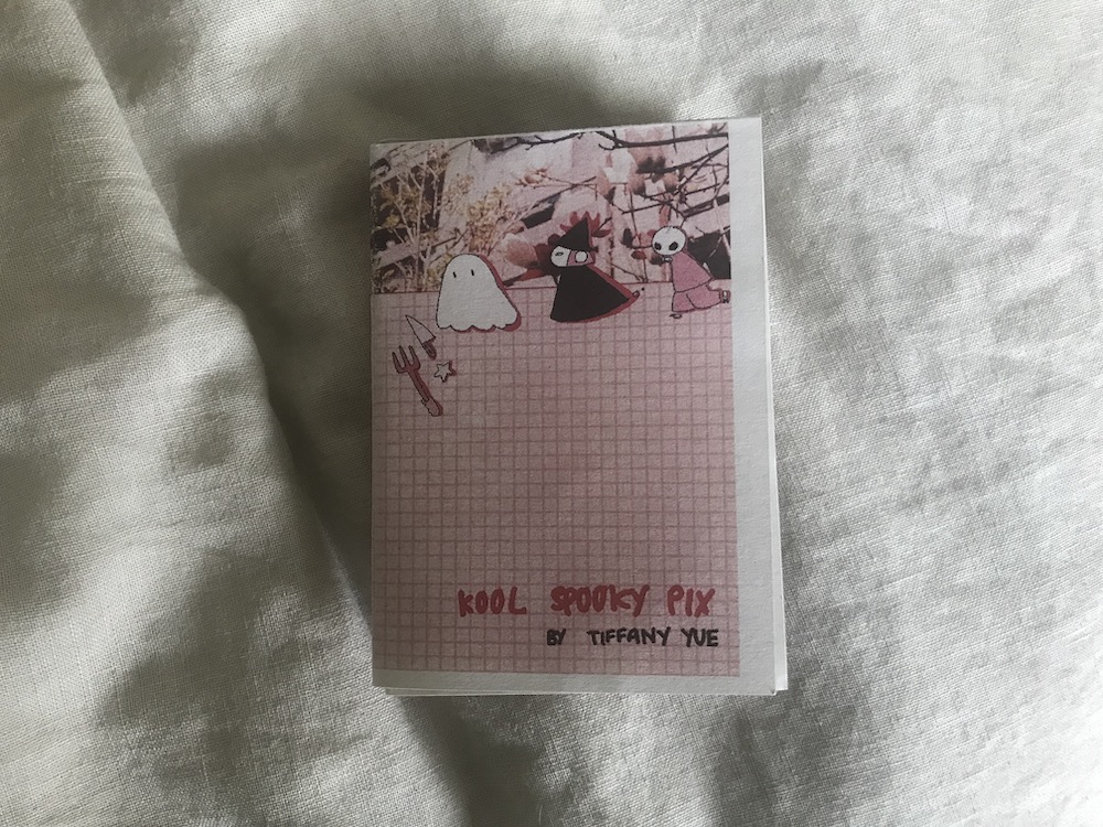 The cover of the Kool Spooky Pix zine, with little drawings of a ghost, a withc and a goul against a pink and red grid and a photos of trees and buildings