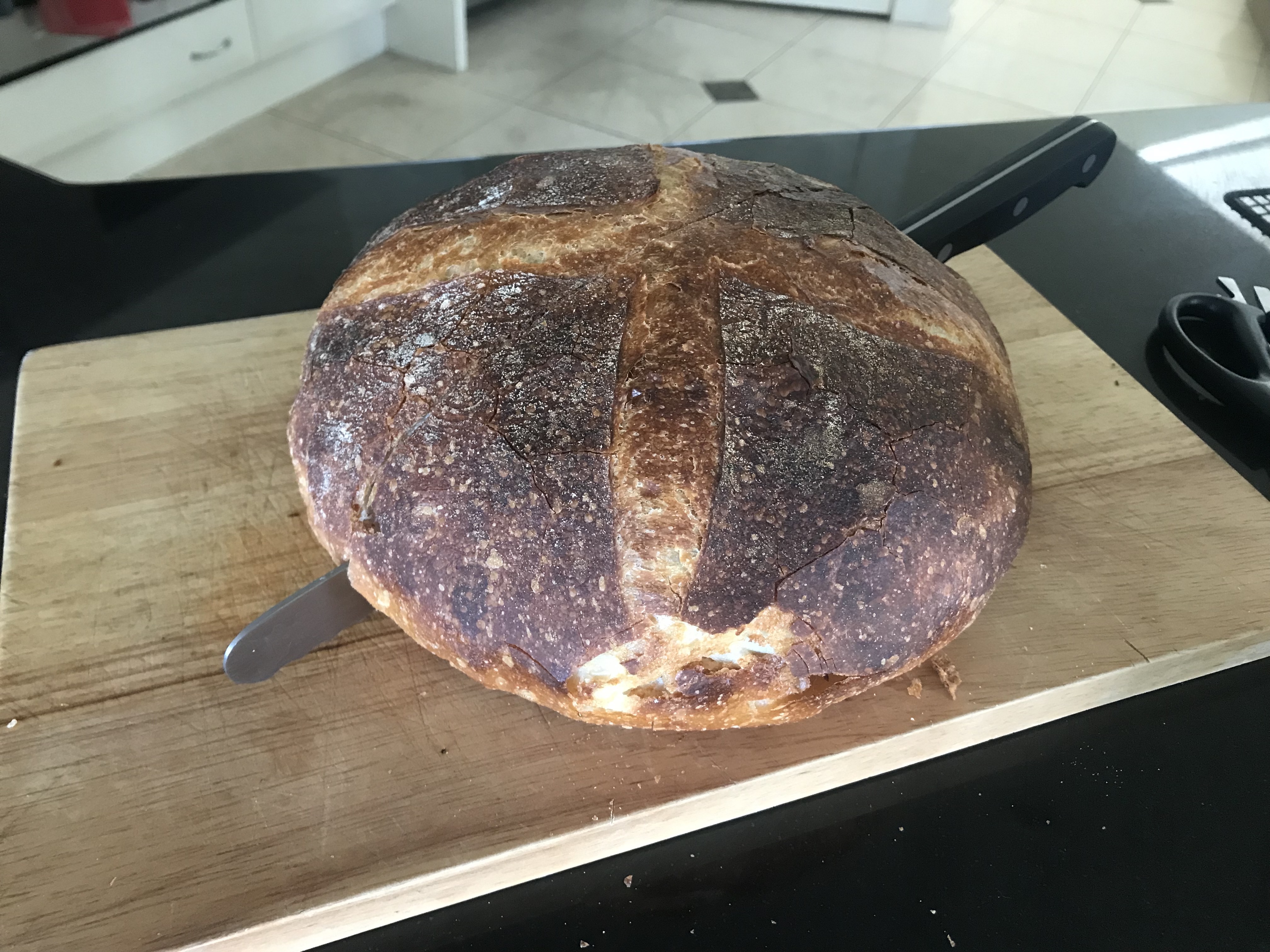 Bread with a knife in it, from the side