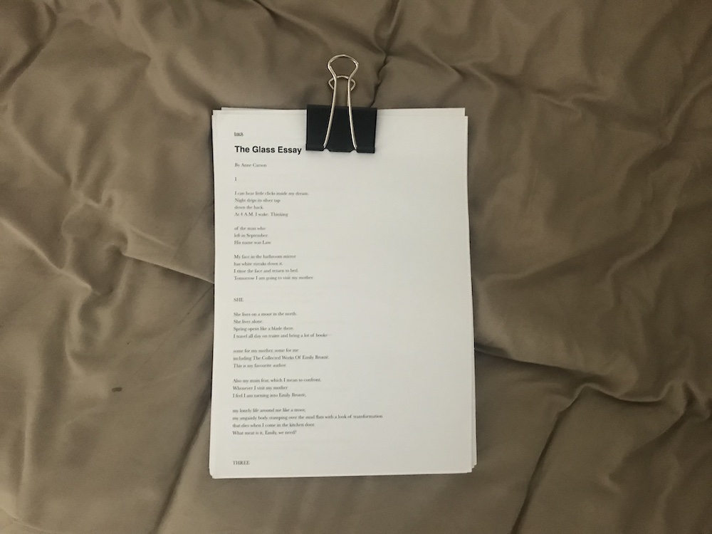 print out of Anne Carson's The Glass Essay, held together with a bull clip