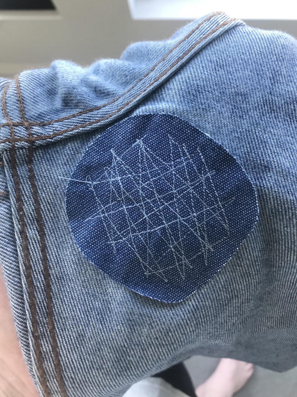 the inside of a patched hole in some jeans